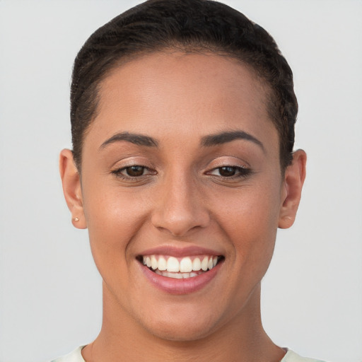 Joyful white young-adult female with short  brown hair and brown eyes