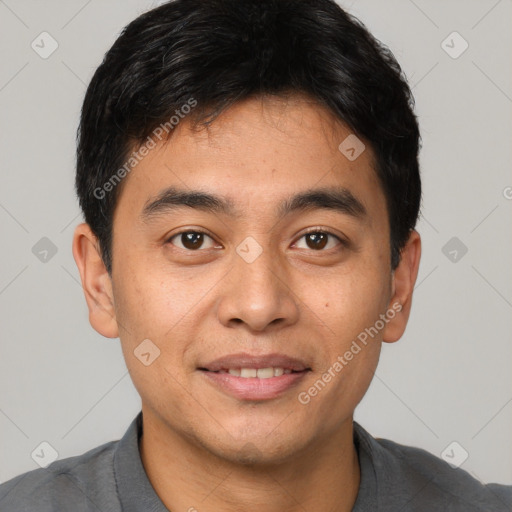 Joyful white young-adult male with short  black hair and brown eyes