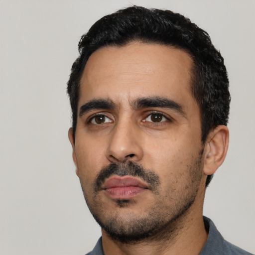 Neutral latino young-adult male with short  black hair and brown eyes