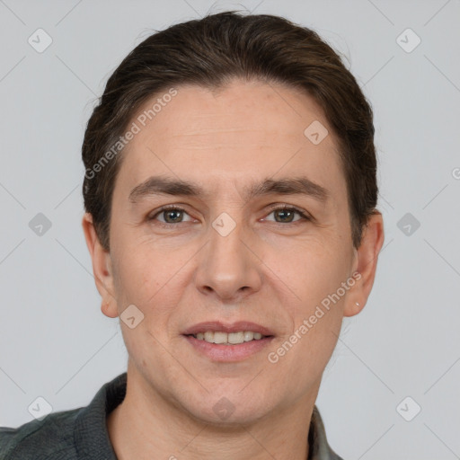 Joyful white adult male with short  brown hair and grey eyes