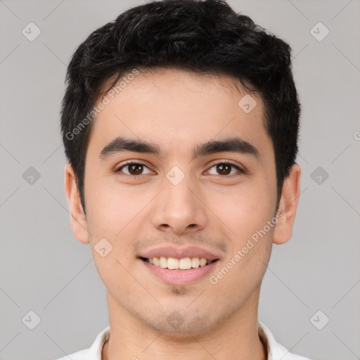 Joyful white young-adult male with short  black hair and brown eyes