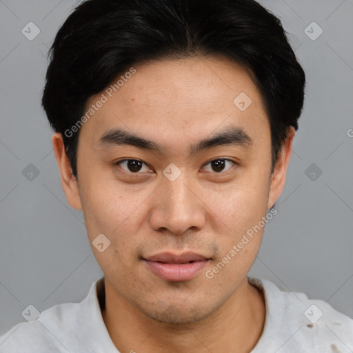 Joyful asian young-adult male with short  black hair and brown eyes