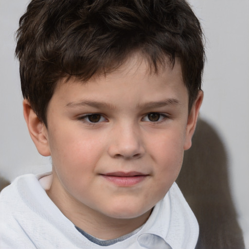 Joyful white child male with short  brown hair and brown eyes