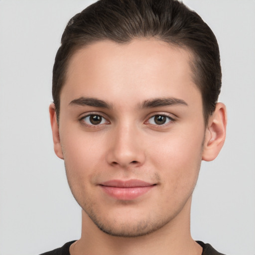 Joyful white young-adult male with short  brown hair and brown eyes