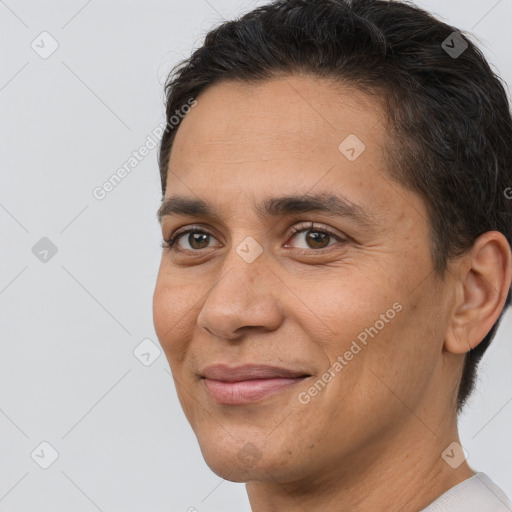 Joyful white adult male with short  brown hair and brown eyes