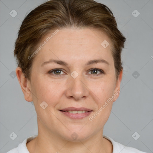 Joyful white adult female with short  brown hair and grey eyes