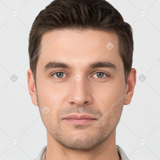 Neutral white young-adult male with short  brown hair and brown eyes