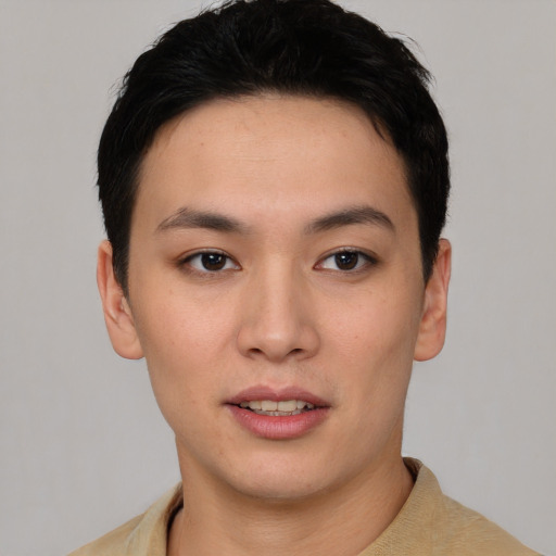 Joyful asian young-adult female with short  black hair and brown eyes