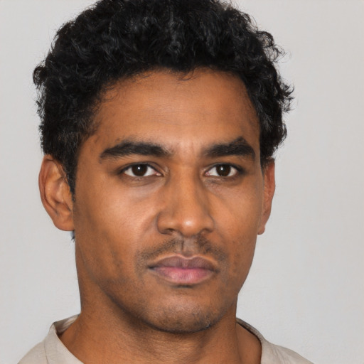 Neutral black young-adult male with short  black hair and brown eyes