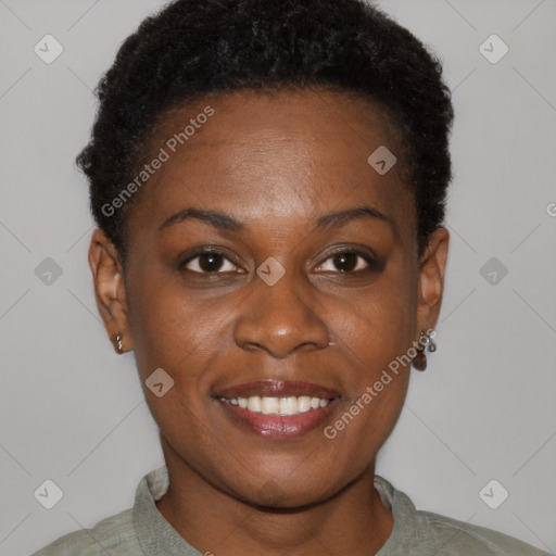 Joyful black young-adult female with short  brown hair and brown eyes