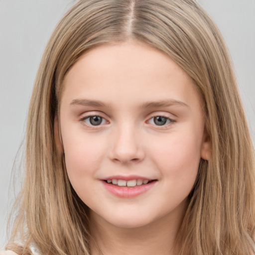 Joyful white child female with long  brown hair and brown eyes