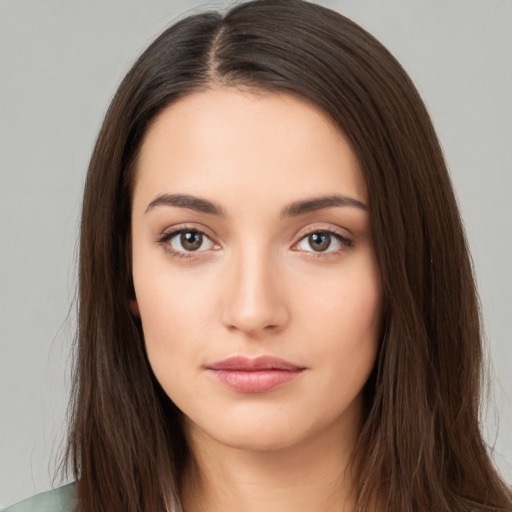 Neutral white young-adult female with long  brown hair and brown eyes