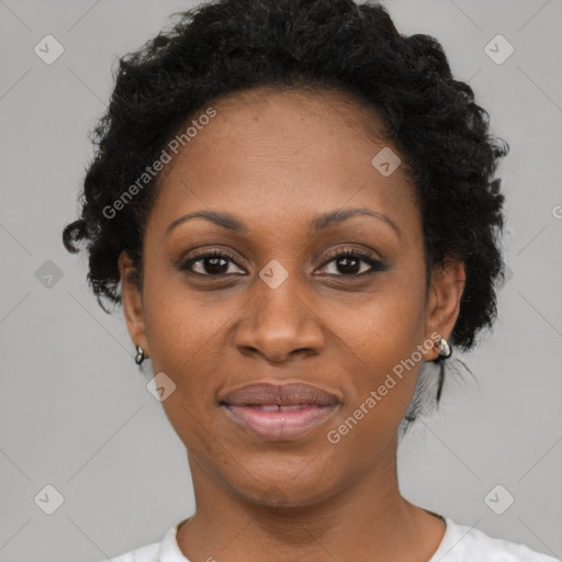 Joyful black adult female with short  brown hair and brown eyes