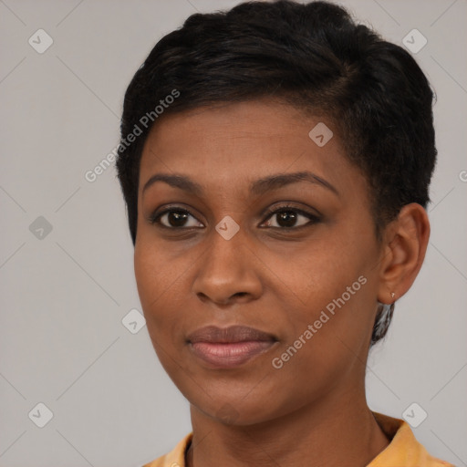 Joyful black young-adult female with short  brown hair and brown eyes