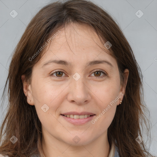 Joyful white adult female with long  brown hair and brown eyes