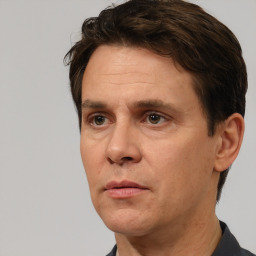 Neutral white adult male with short  brown hair and brown eyes