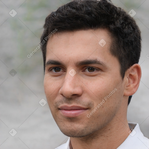 Joyful white young-adult male with short  black hair and brown eyes