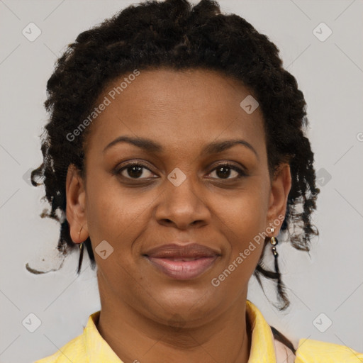 Joyful black adult female with short  brown hair and brown eyes