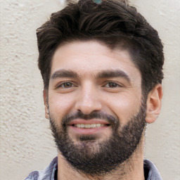 Joyful white young-adult male with short  black hair and brown eyes