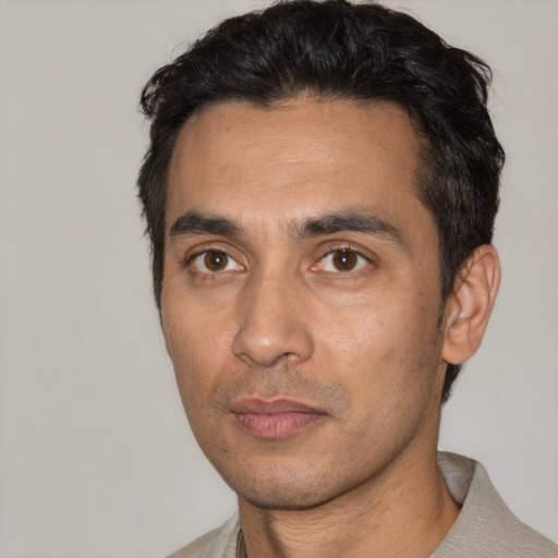 Neutral white adult male with short  black hair and brown eyes