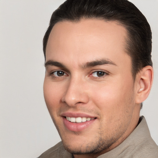 Joyful white young-adult male with short  brown hair and brown eyes