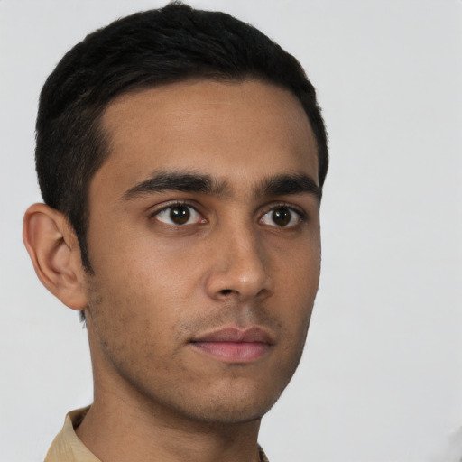 Neutral latino young-adult male with short  brown hair and brown eyes