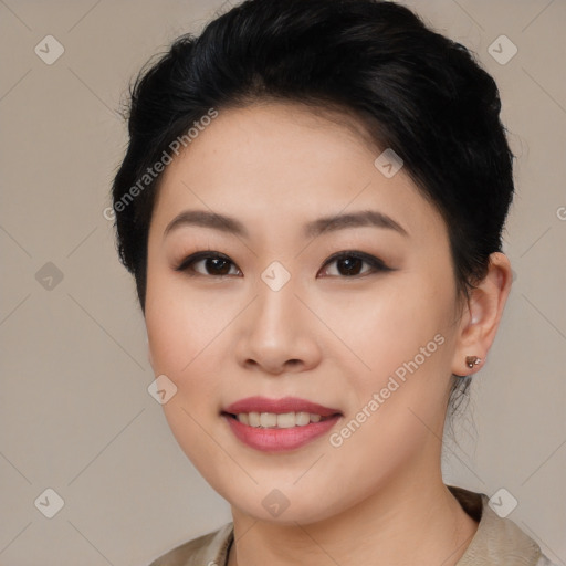 Joyful asian young-adult female with short  brown hair and brown eyes