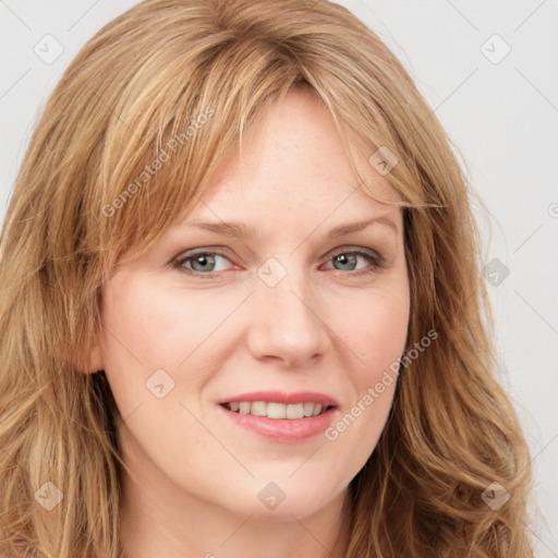 Joyful white young-adult female with long  brown hair and green eyes