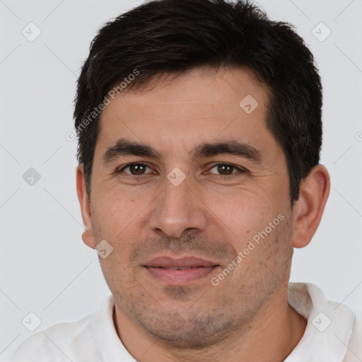 Joyful white adult male with short  brown hair and brown eyes