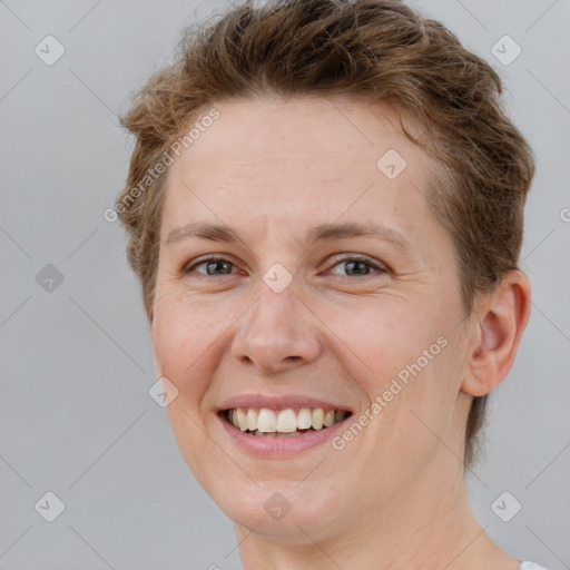 Joyful white young-adult female with short  brown hair and brown eyes