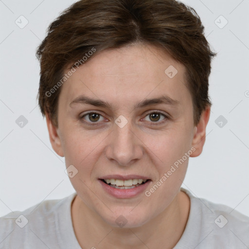 Joyful white young-adult female with short  brown hair and grey eyes