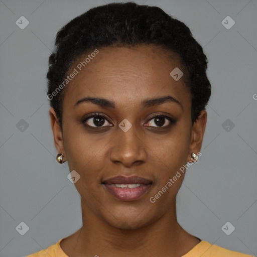 Joyful black young-adult female with short  black hair and brown eyes