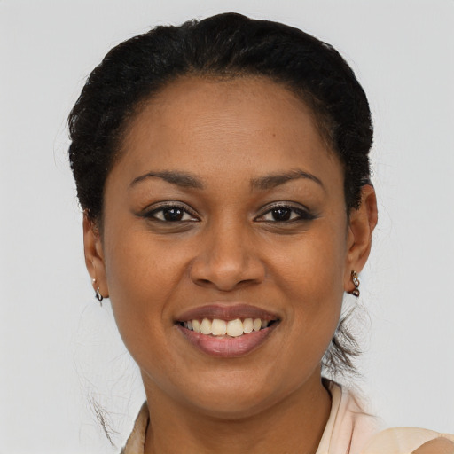 Joyful latino young-adult female with short  brown hair and brown eyes