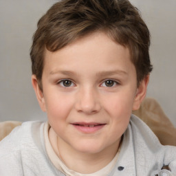 Joyful white child female with short  brown hair and brown eyes