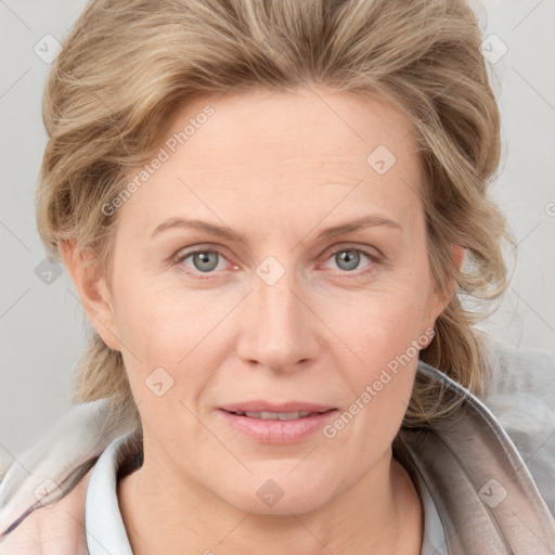 Joyful white adult female with medium  brown hair and blue eyes