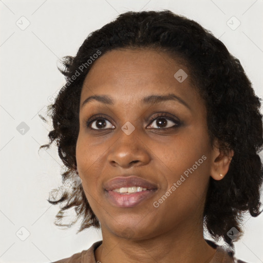 Joyful black young-adult female with medium  black hair and brown eyes