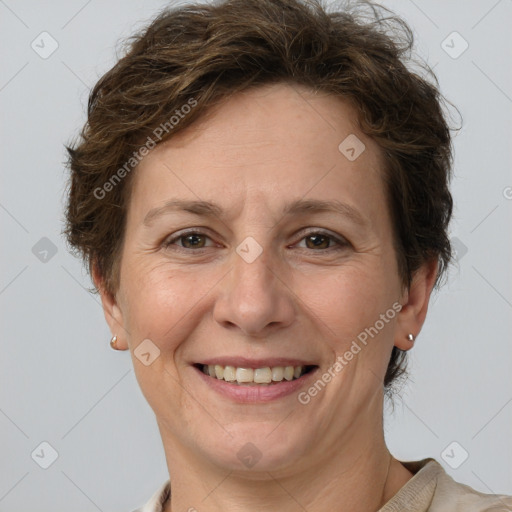 Joyful white adult female with short  brown hair and grey eyes