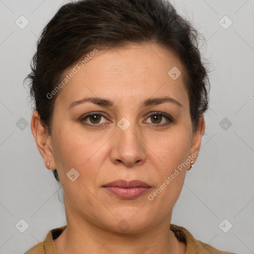 Joyful white adult female with short  brown hair and brown eyes