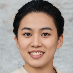 Joyful asian young-adult female with short  black hair and brown eyes