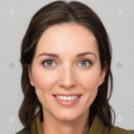 Joyful white young-adult female with medium  brown hair and green eyes