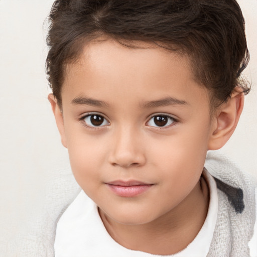 Joyful white child female with short  brown hair and brown eyes