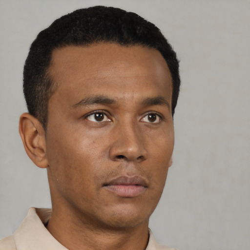 Neutral black young-adult male with short  black hair and brown eyes