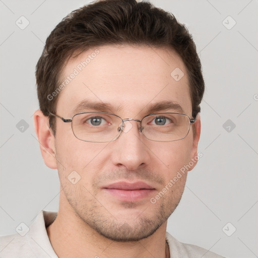 Joyful white young-adult male with short  brown hair and grey eyes