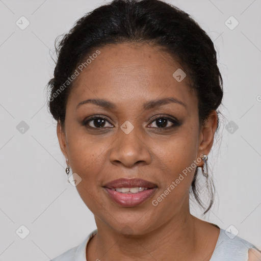 Joyful black adult female with medium  brown hair and brown eyes