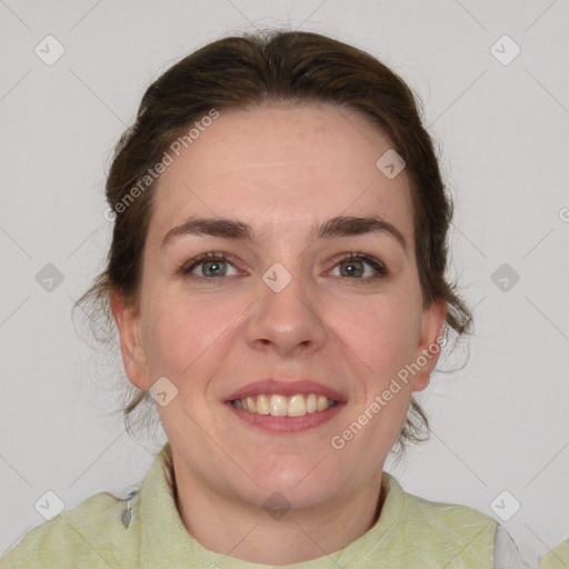 Joyful white young-adult female with medium  brown hair and green eyes