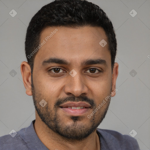 Joyful black young-adult male with short  black hair and brown eyes