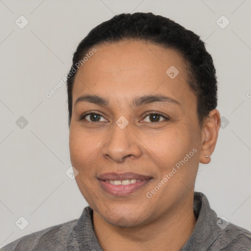 Joyful latino young-adult female with short  black hair and brown eyes