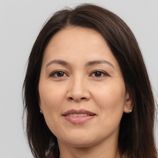 Joyful white adult female with medium  brown hair and brown eyes