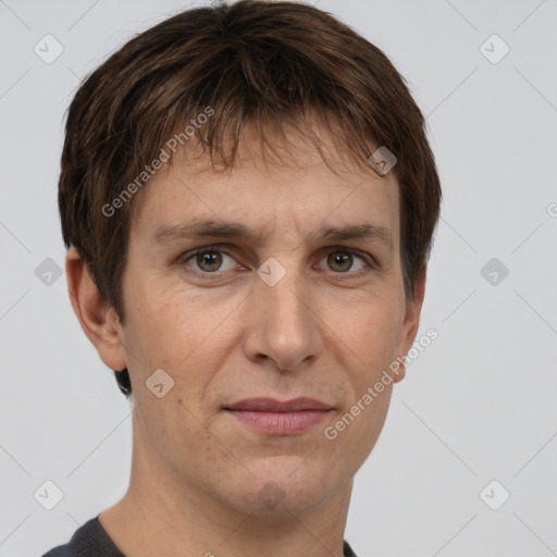 Joyful white adult male with short  brown hair and grey eyes