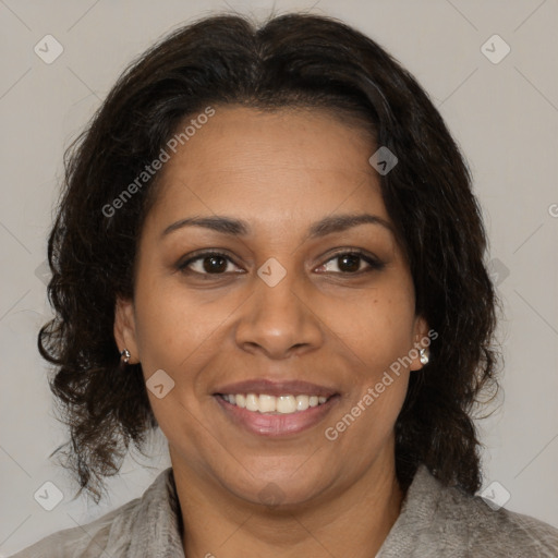 Joyful black adult female with medium  brown hair and brown eyes